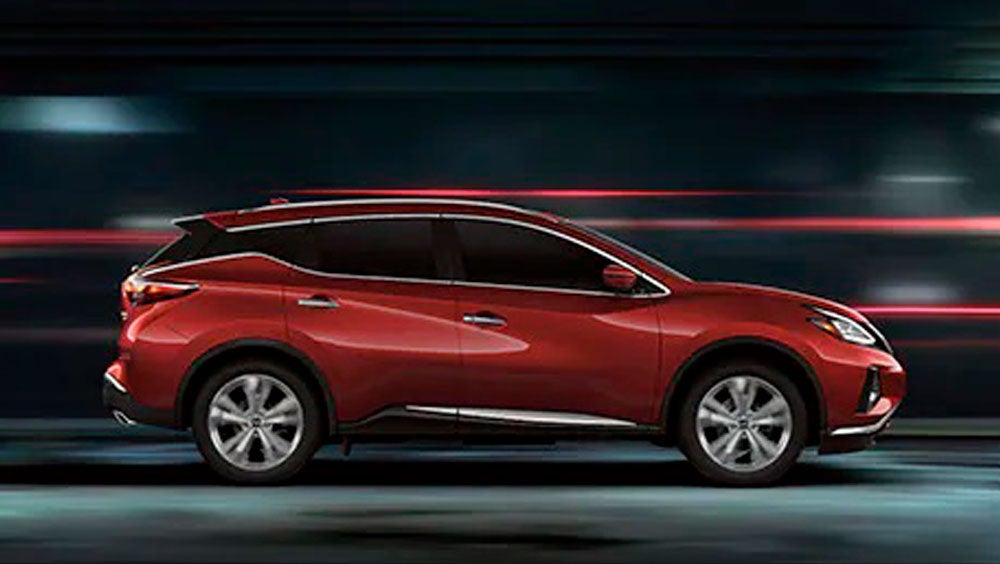 2023 Nissan Murano shown in profile driving down a street at night illustrating performance. | Peruzzi Nissan in Fairless Hills PA